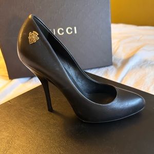 Black Gucci stilettos.